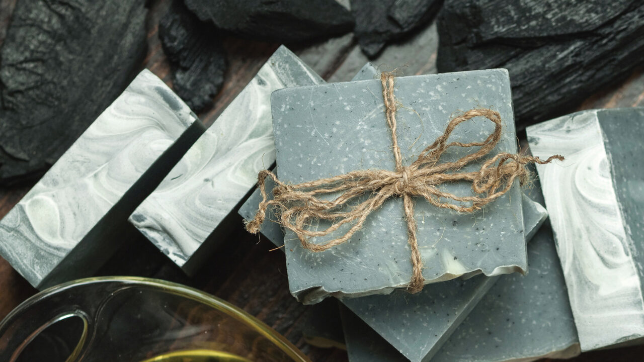 Looking down on various organic soaps tied with rope