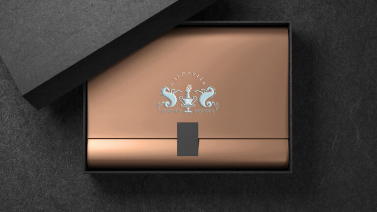 Looking down on copper box with calda vita logo