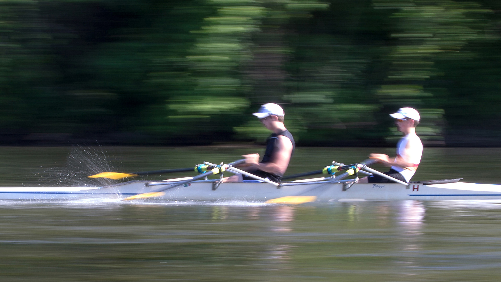 Stratus image of rowers on river from website
