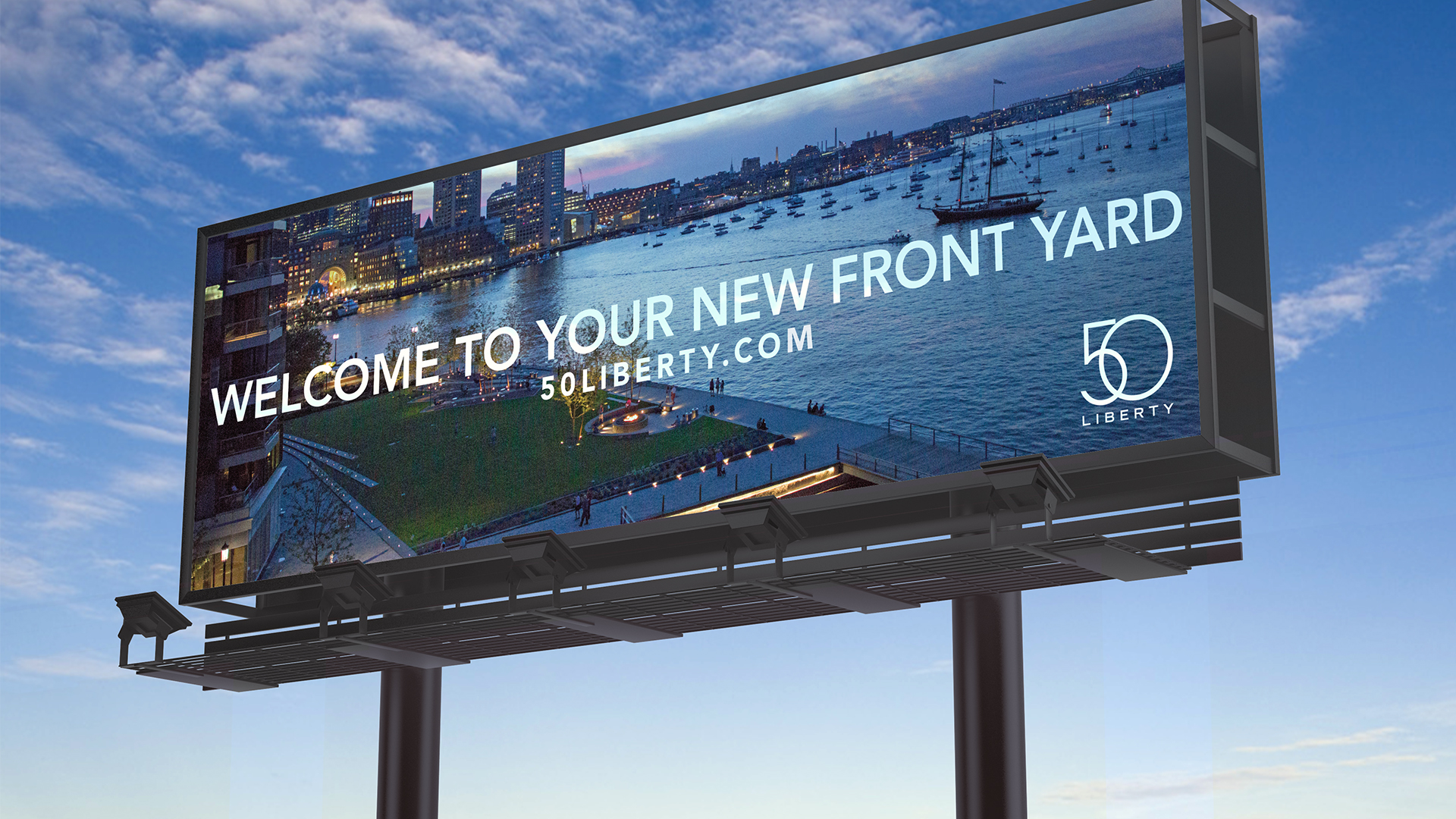 50 liberty billboard backlit against evening sky