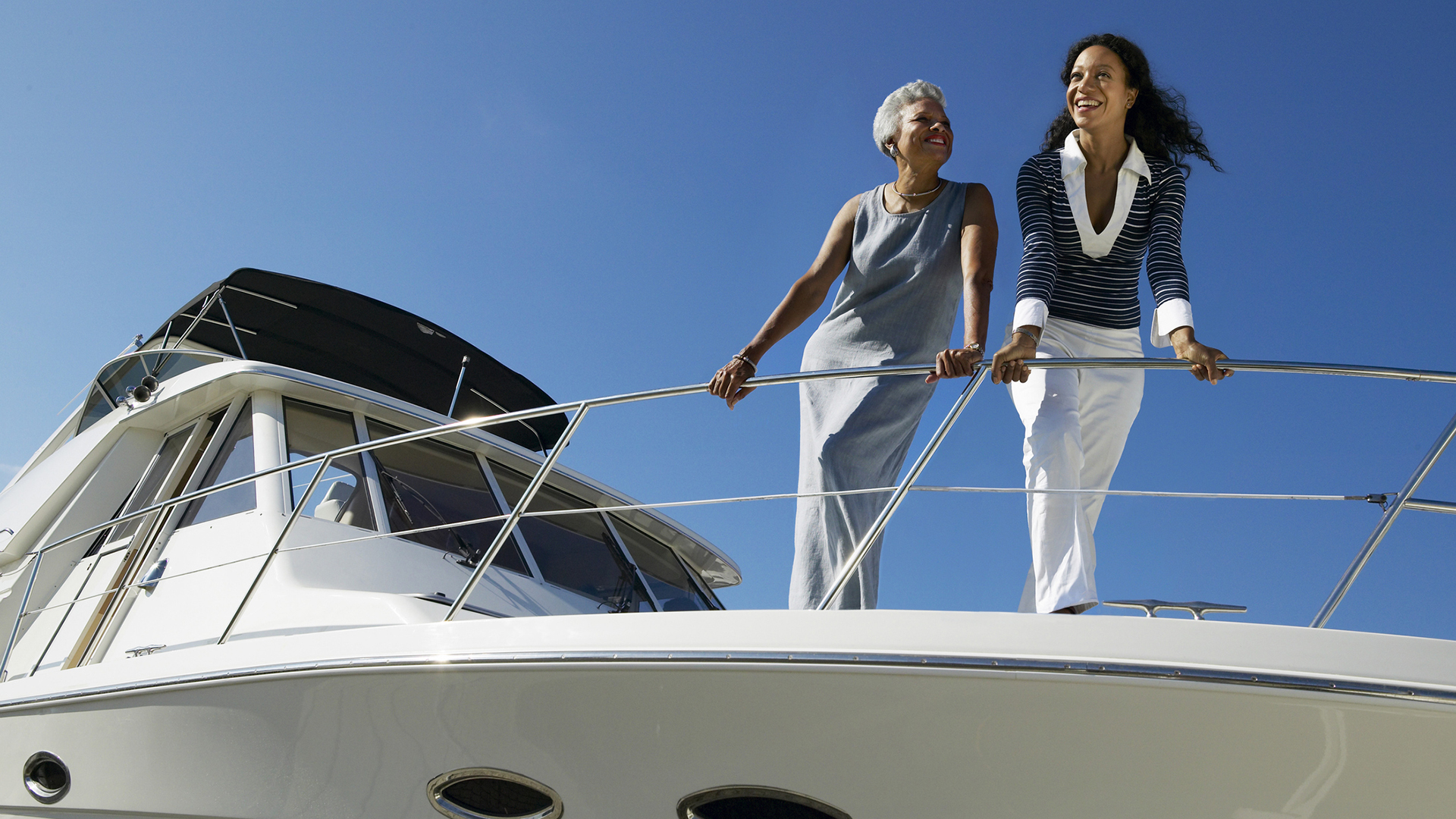 50 liberty two woman on yacht looking down