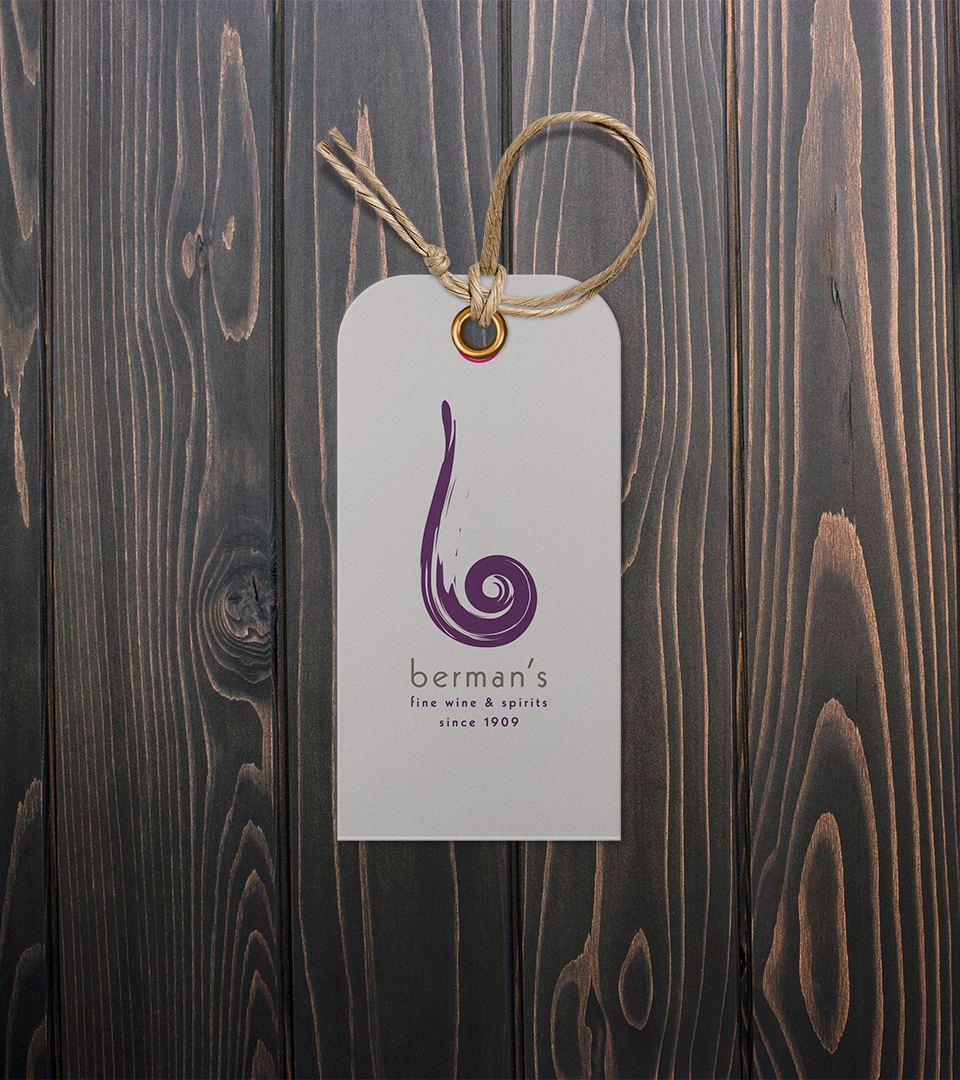 bermans wine tag on dark wood