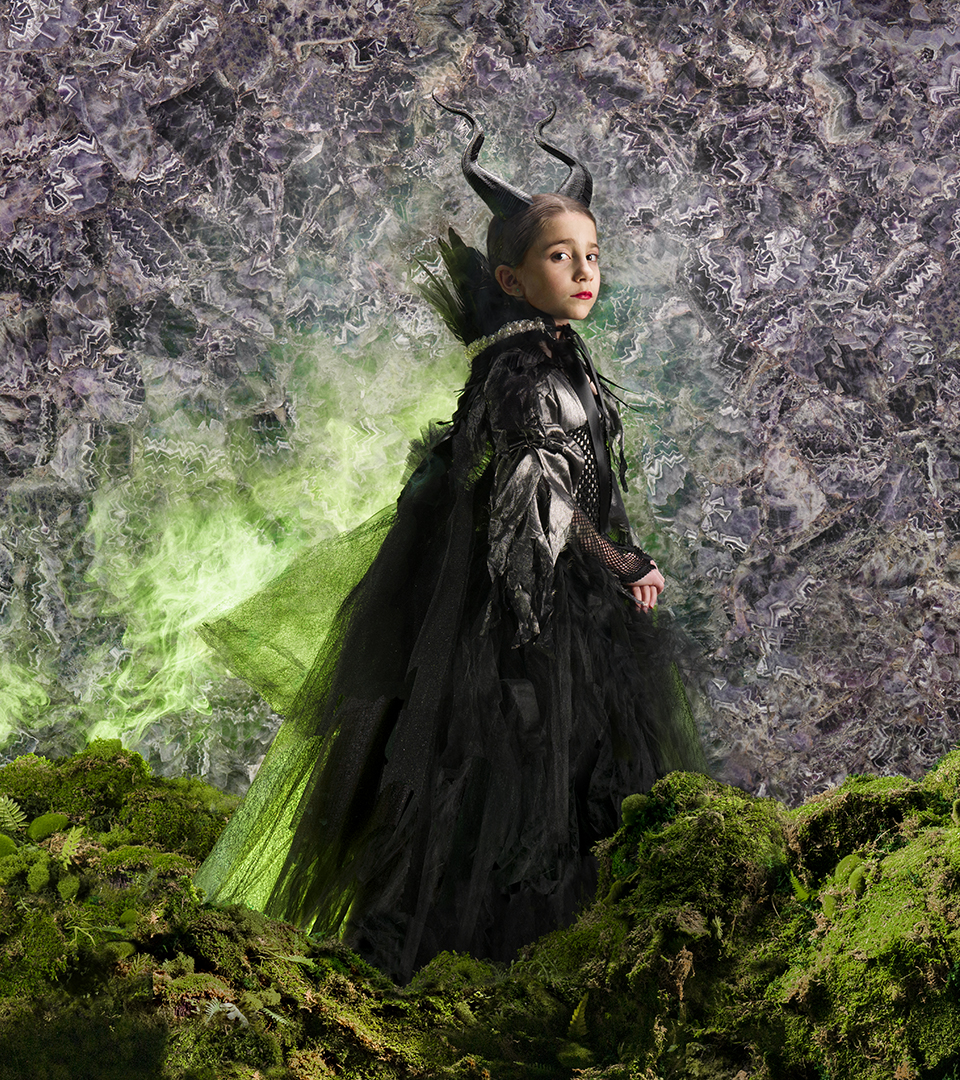 cumar ad with maleficent character and green smoke