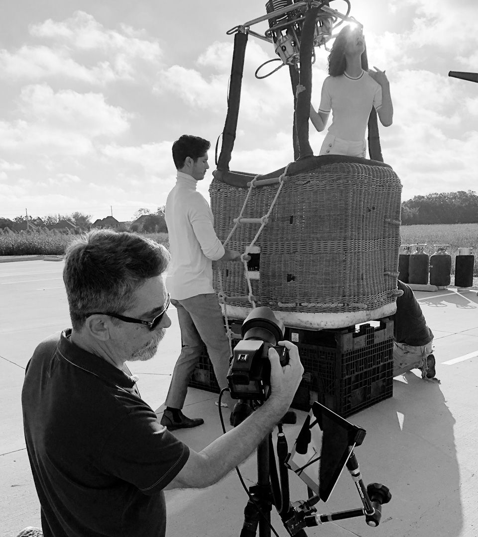 Photoshoot with geof kern and hot air balloon with woman posed for echelonseaport advertising by boston graphic design studio