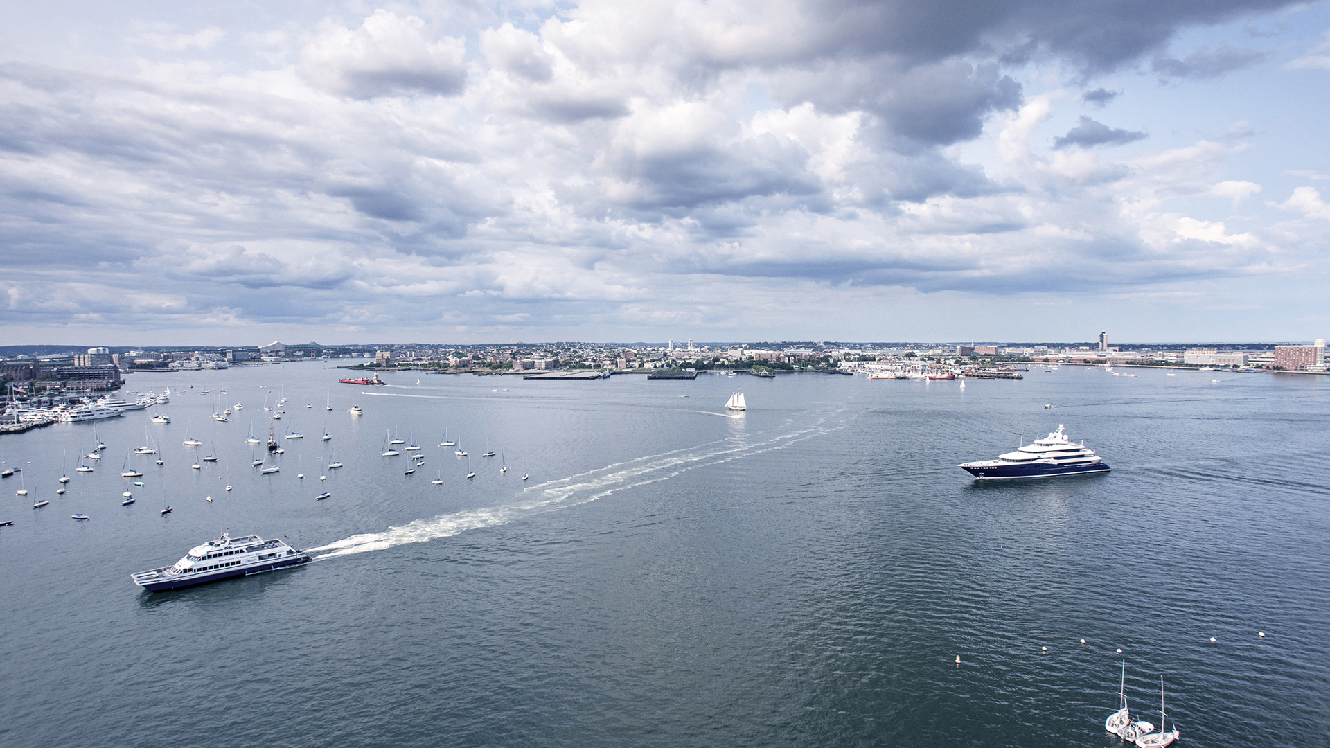 50 liberty looking out at boston harbor with boats