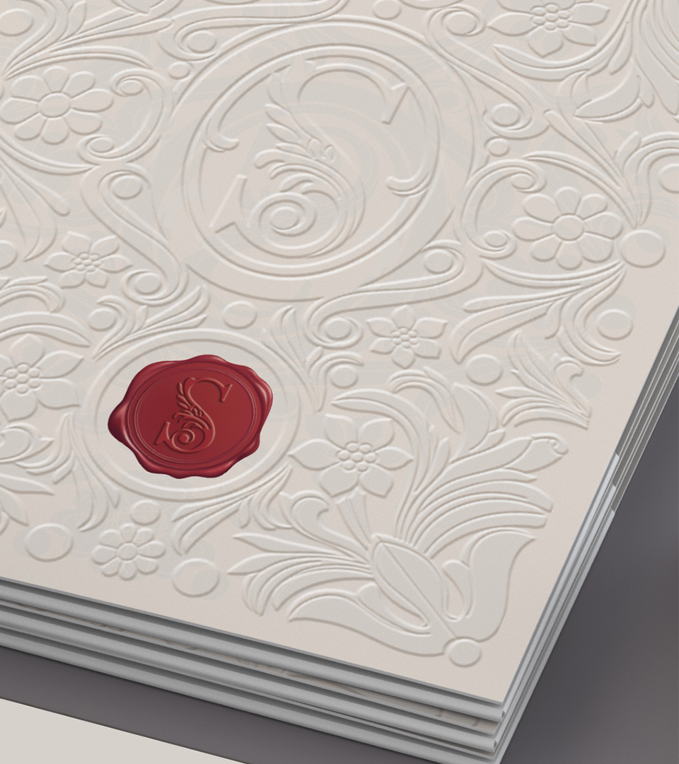 signet folder with red logo stamp on embossed cover by best boston graphic design agency