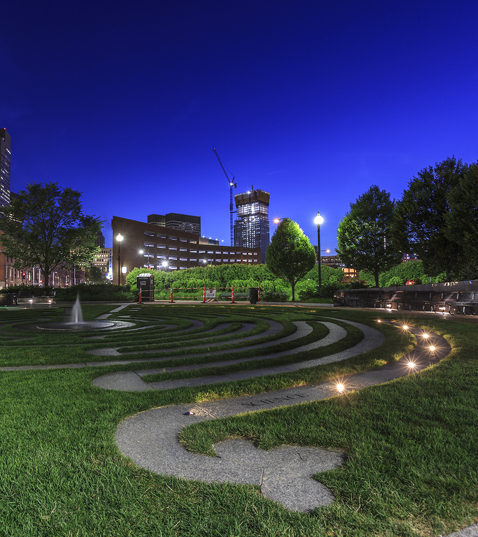 sudbury residences at night with green garden in foreground