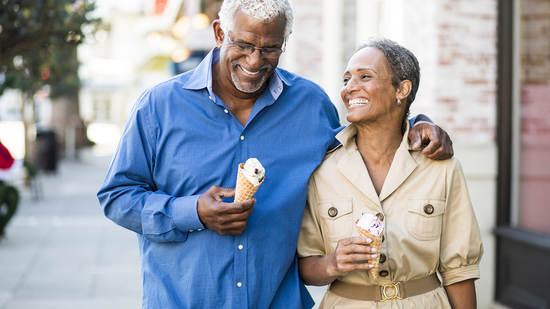 the bristol wellesley african american couple holding ice cream cones walking down street