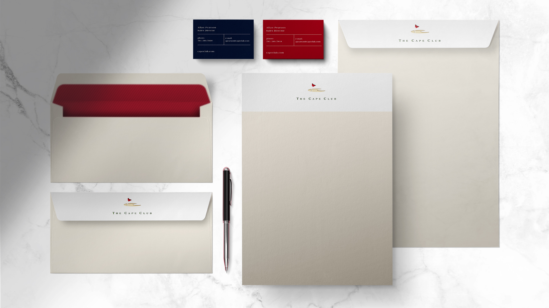 the cape club stationery on a white marble background