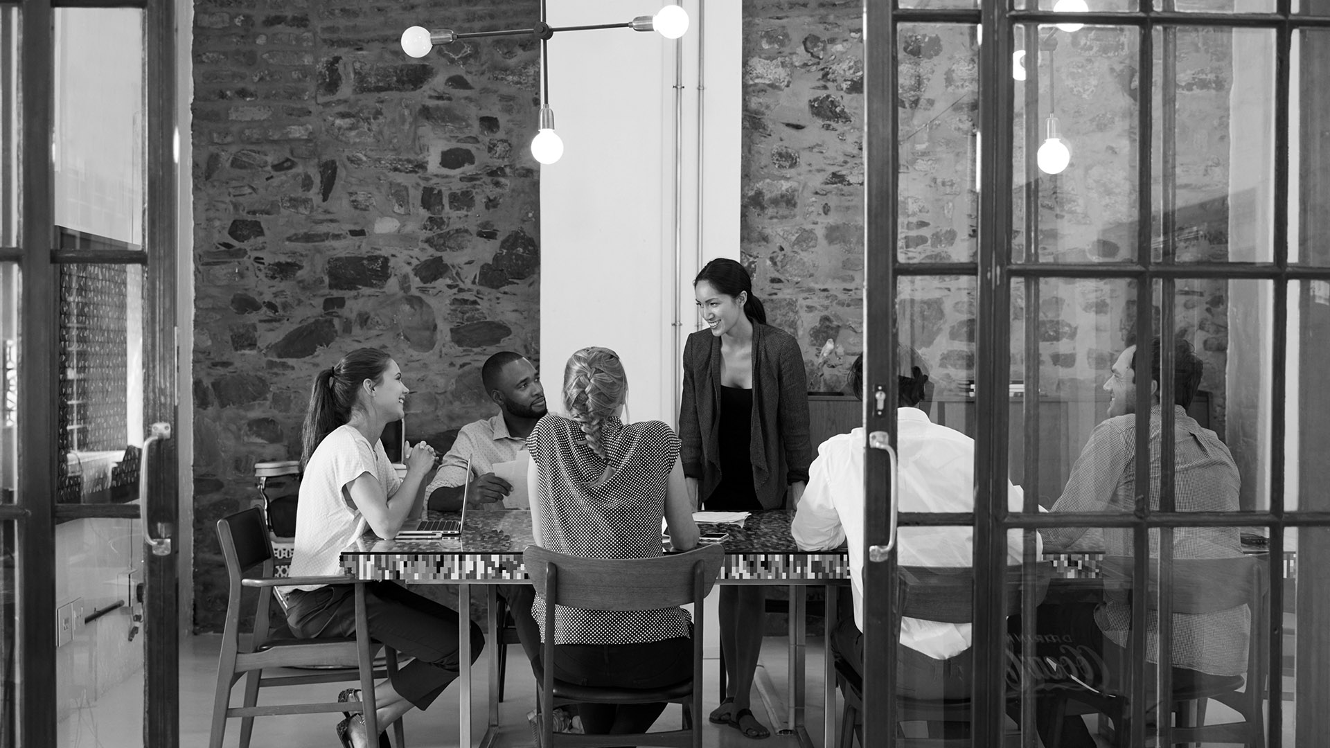 makor office workers at conference table