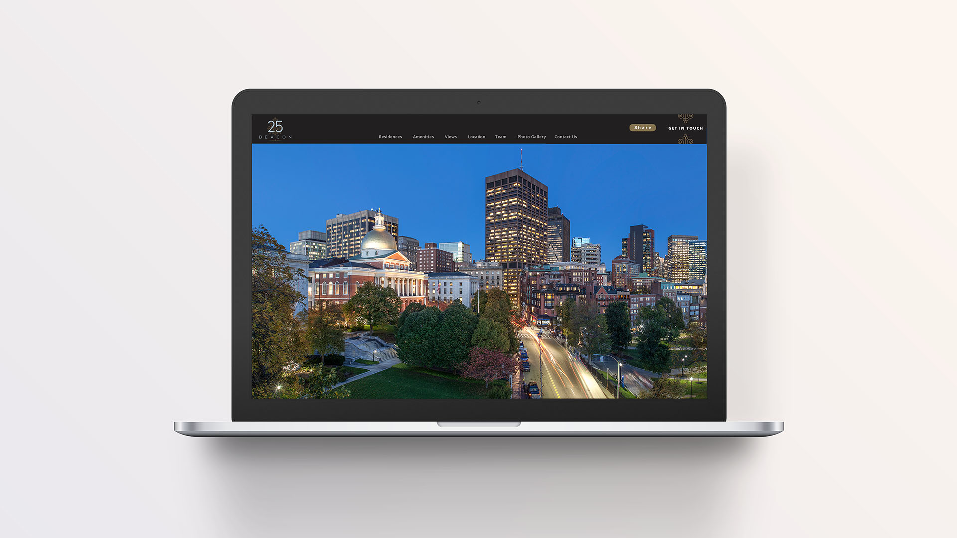 25 beacon laptop. with view of the state house and downtown boston