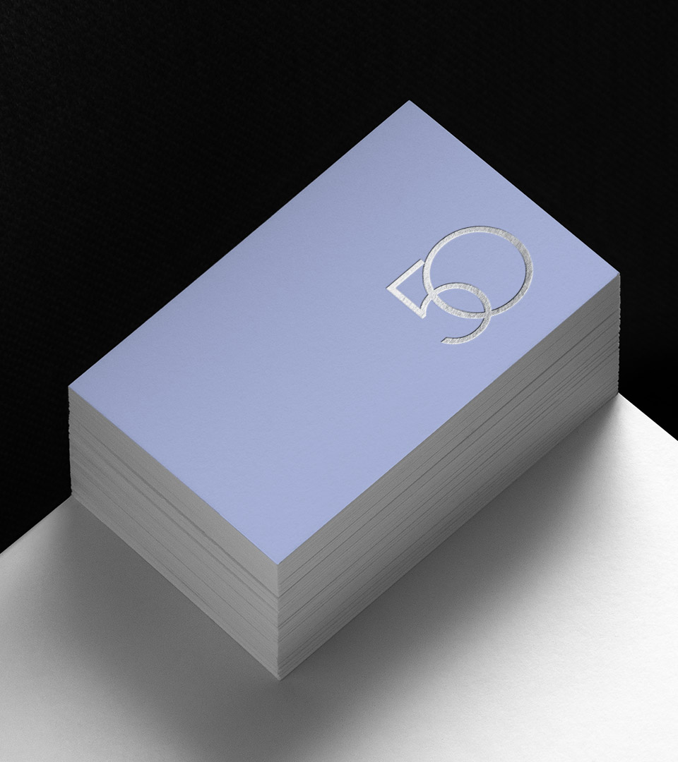 50 liberty business card on white table
