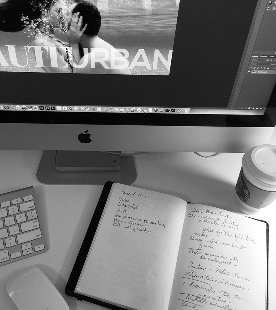 about adams design looking down at desk with notebook