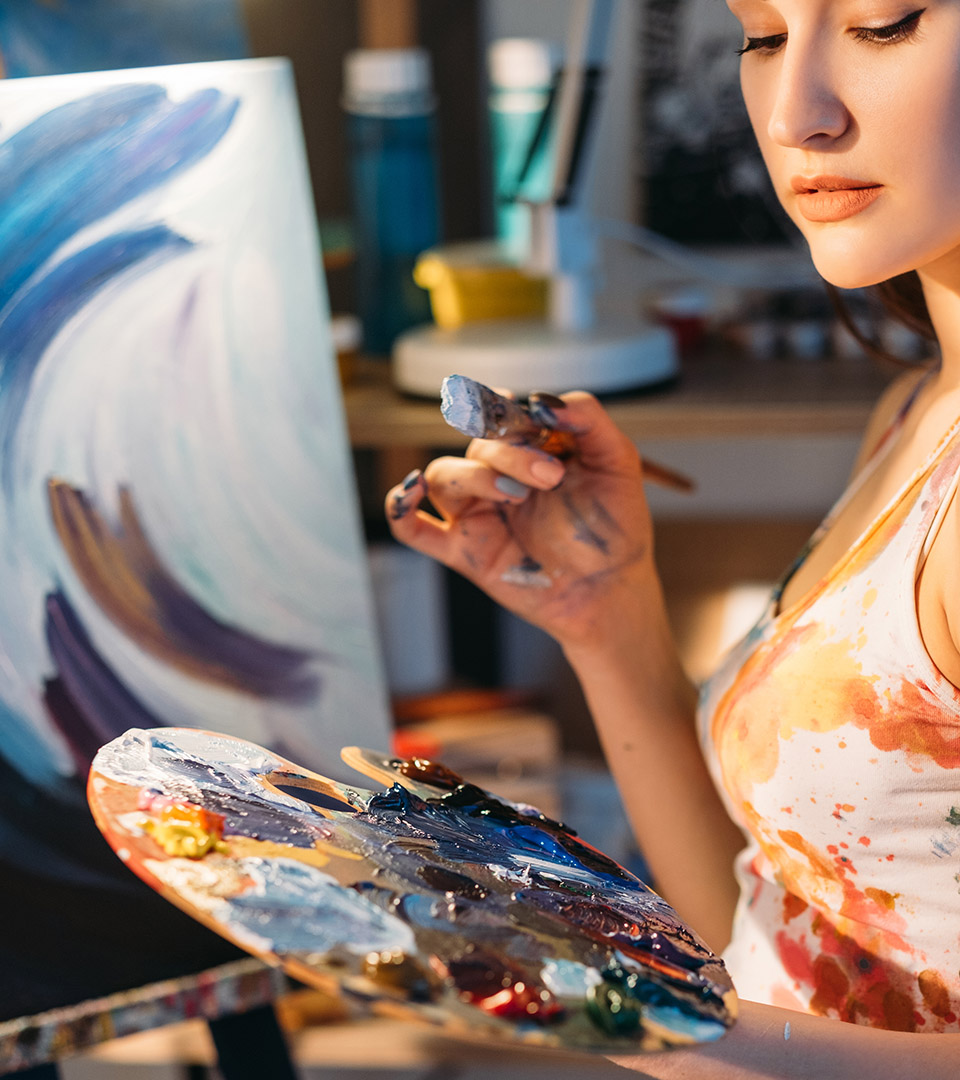appleton mills artist with paintbrush and paint palette
