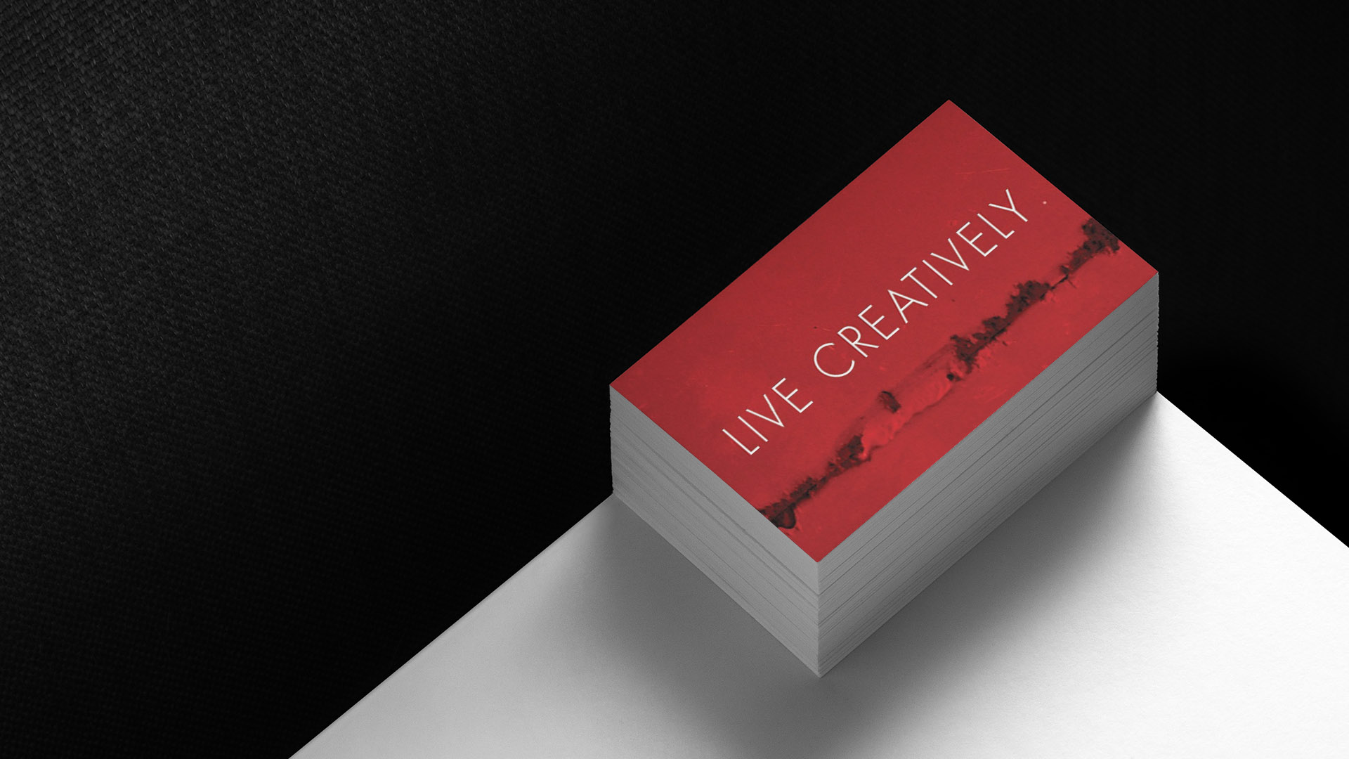 appleton mills business card with live creatively on red stacked