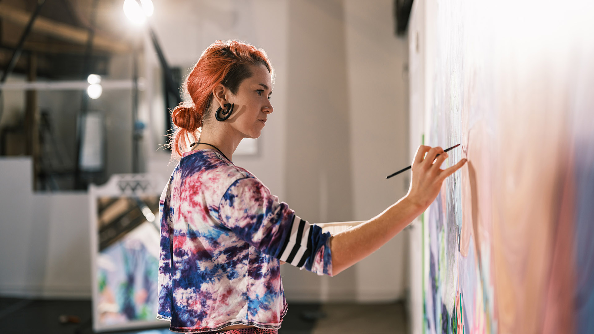 appleton mills red haired woman painting on canvas