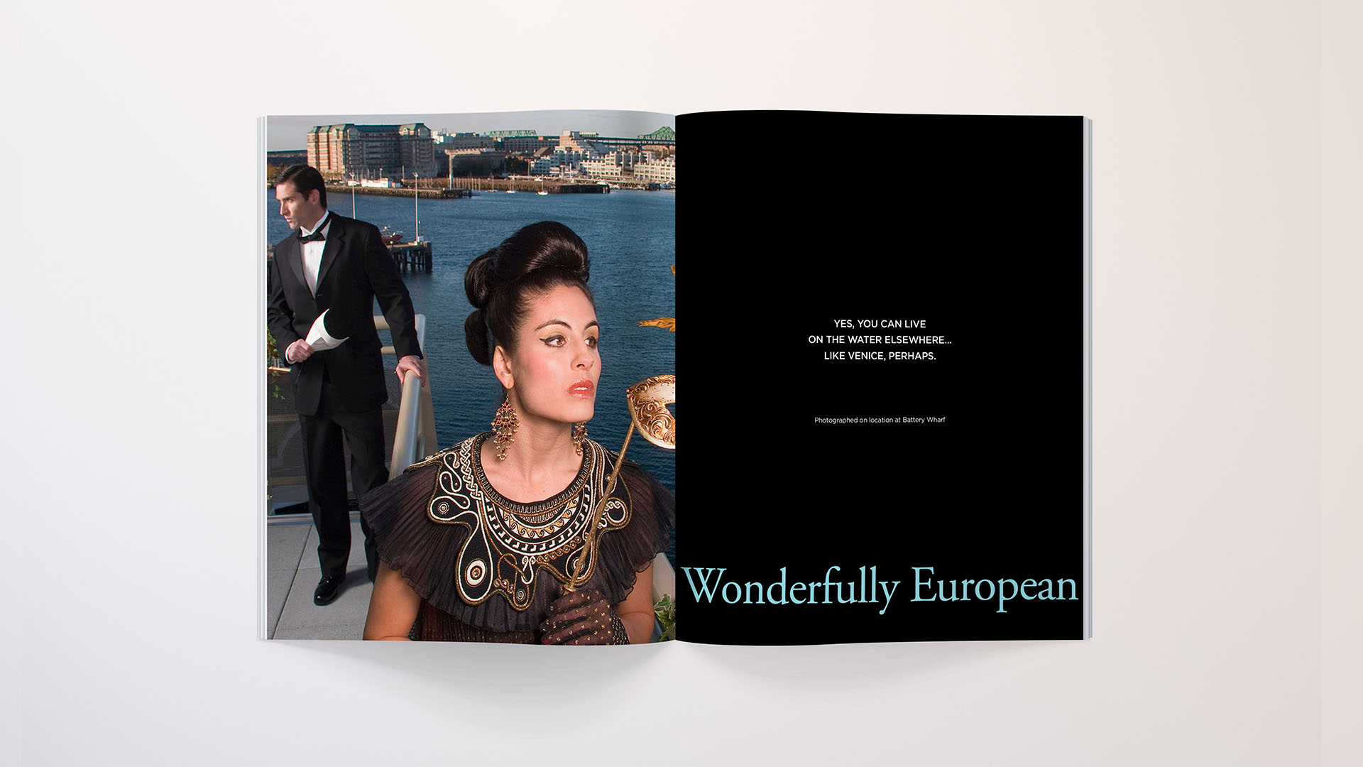 battery wharf woman with venetian mask and man behind her on balcony