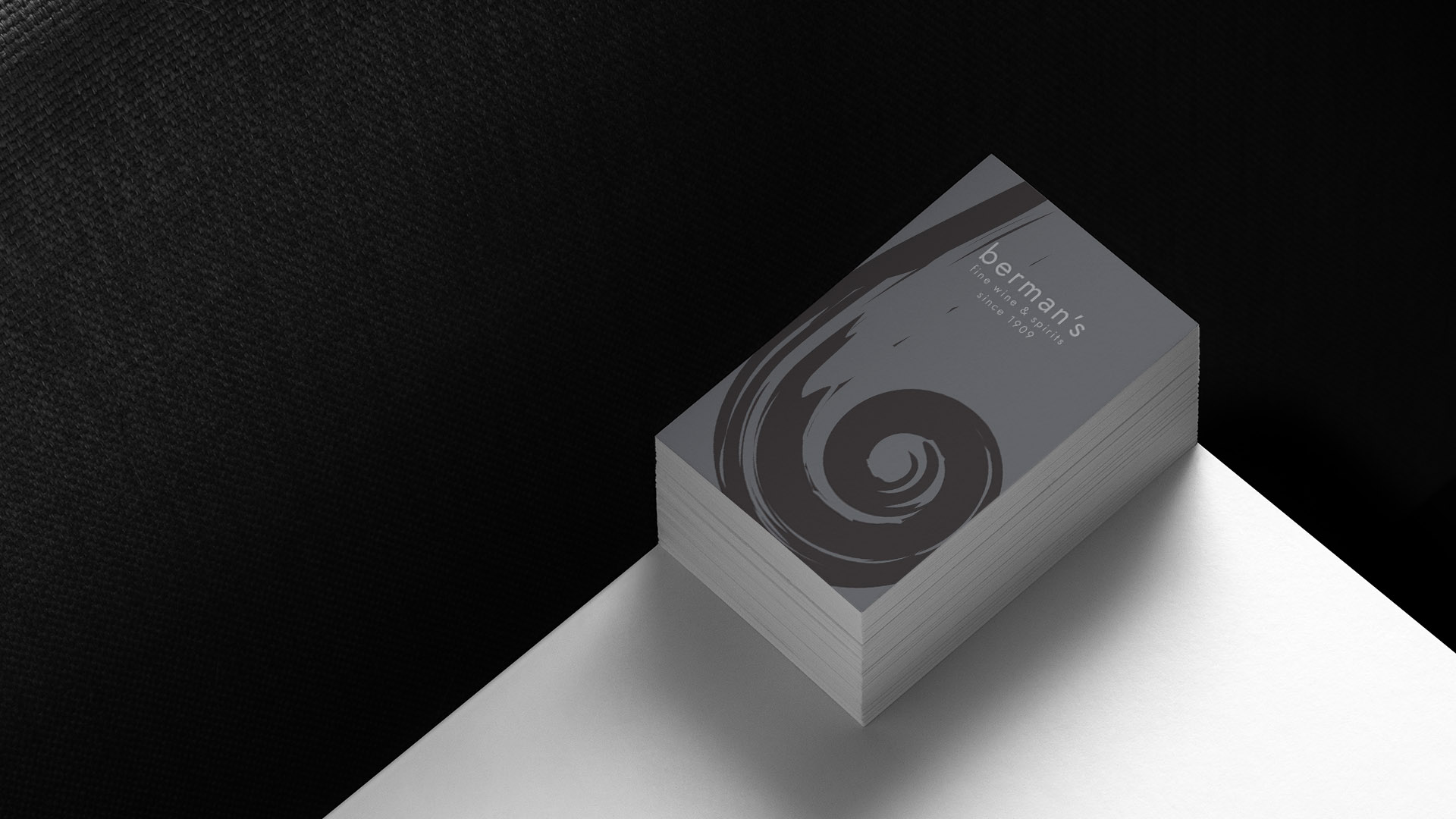 bermans business card on white table