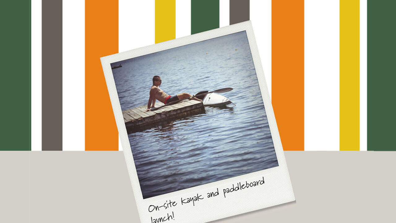 boston east folder with poloraid of man sitting on dock with kayak