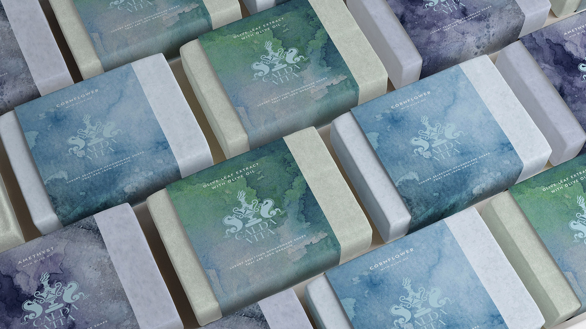 Boston-based graphic design and branding studio delivering memorable logos, identity systems, created the visual identity for Calda Vita including the soap wraps with green, blue and lavendar watercolor backgrounds.