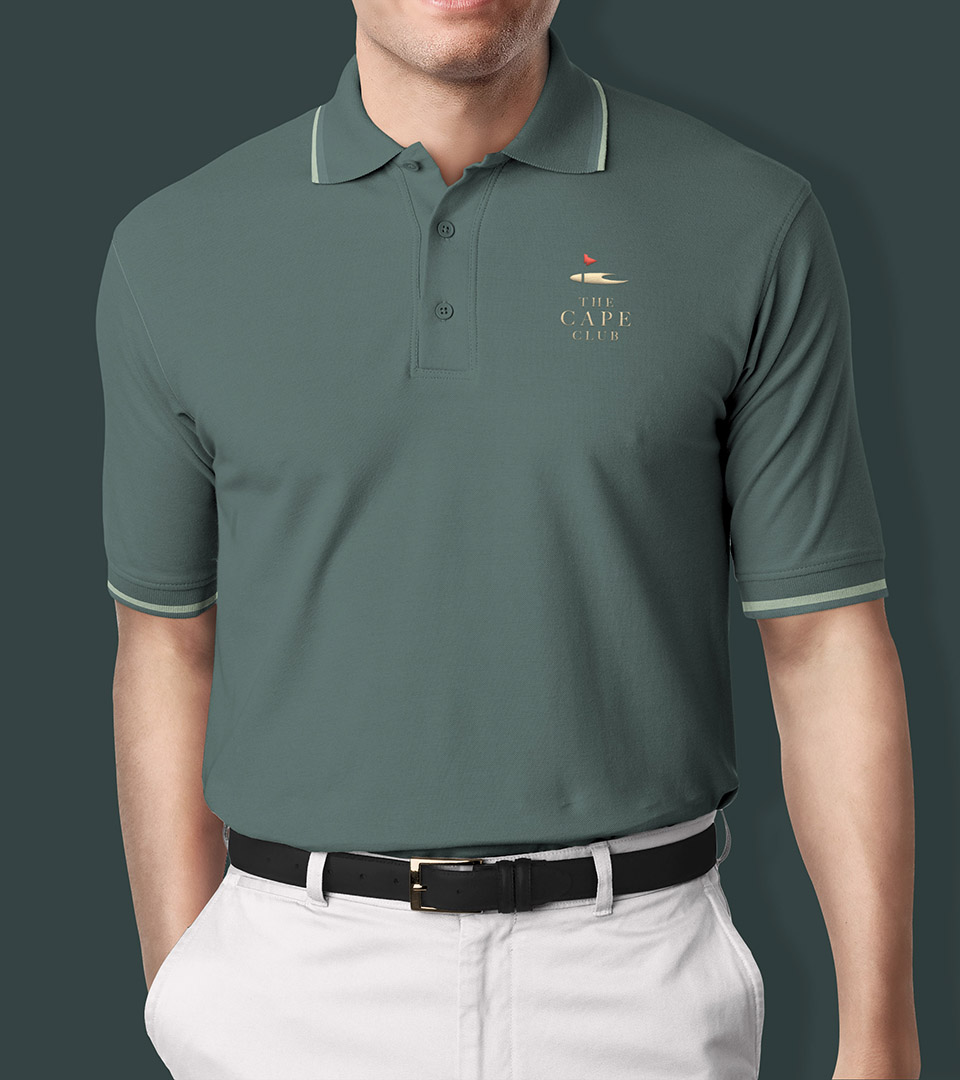 cape club polo shirt with green background and new red
