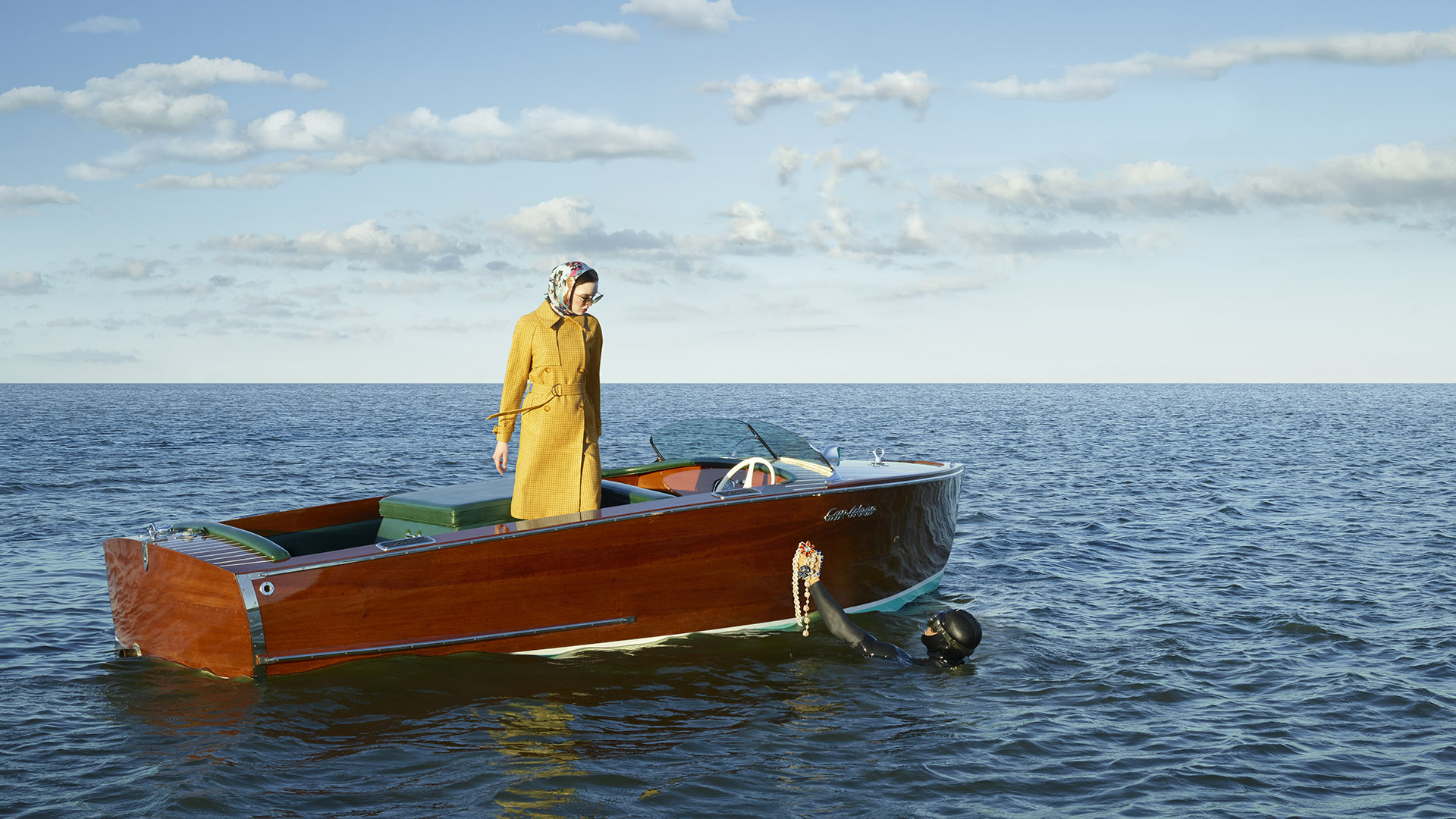 echelon seaport woman in boat with diver holding treasure