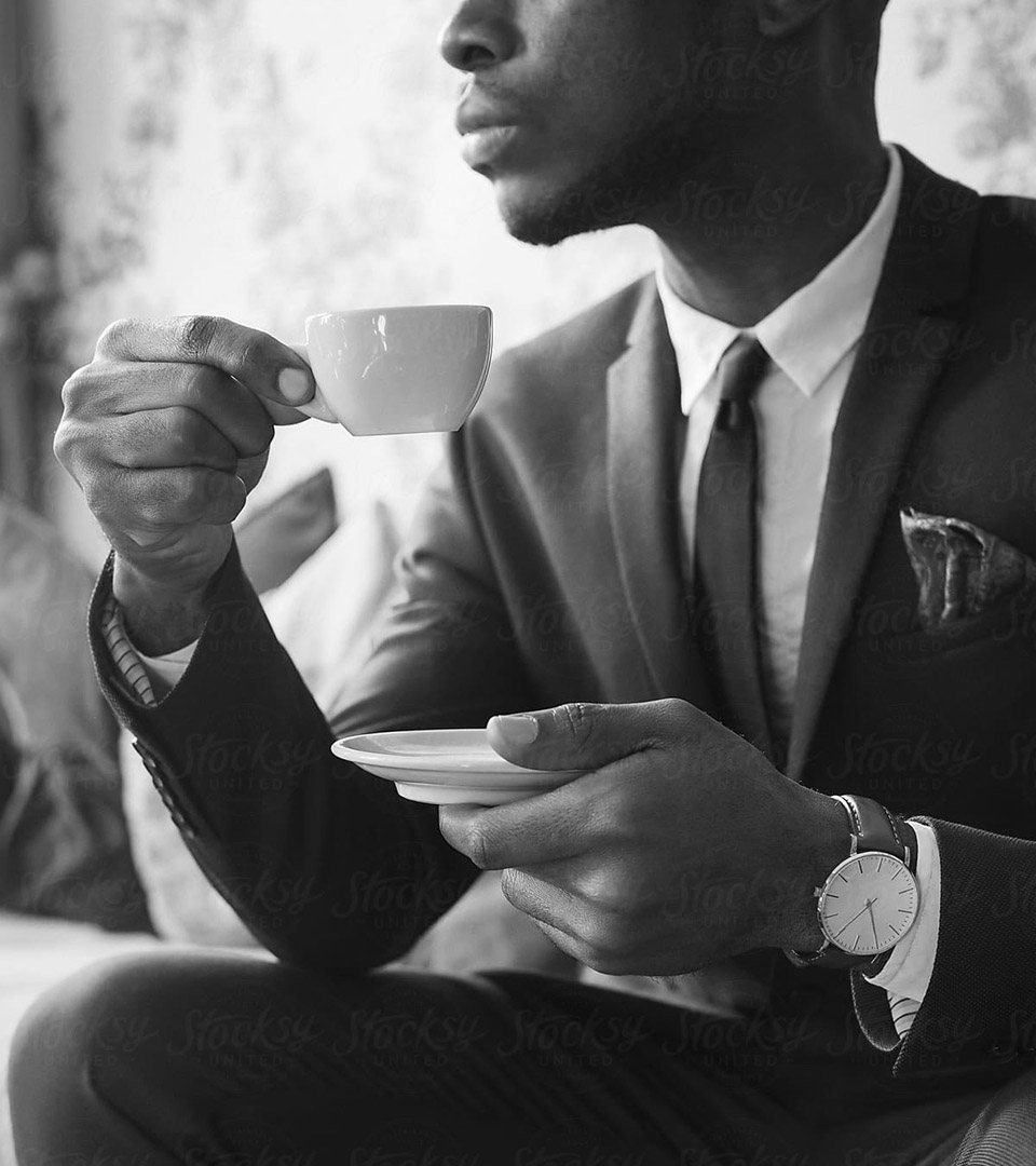 fairmont hamilton princess african american man in suite drinking coffee