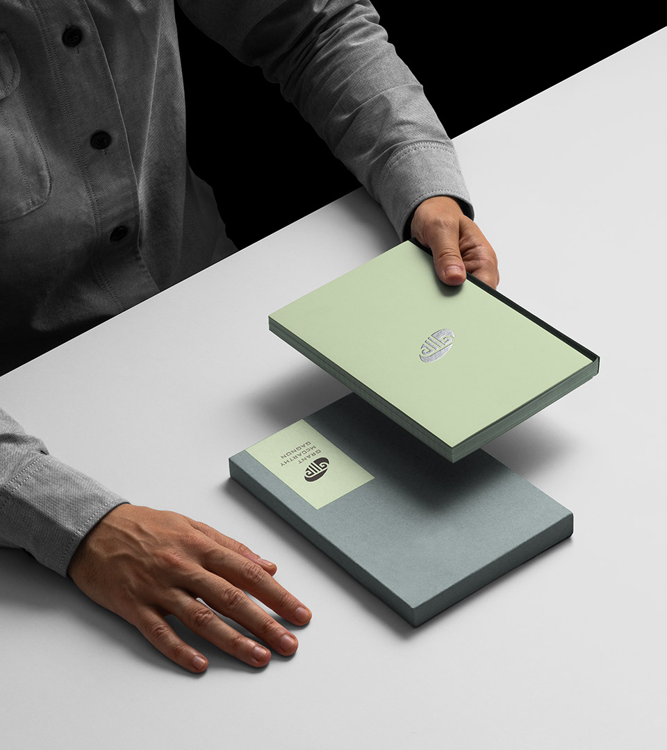 grant mccarthy gagnon man holding book in box vertial