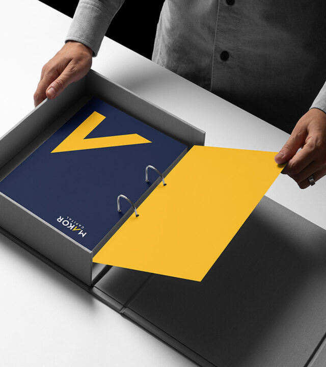 makor capital box and yellow arrow on binder vertical