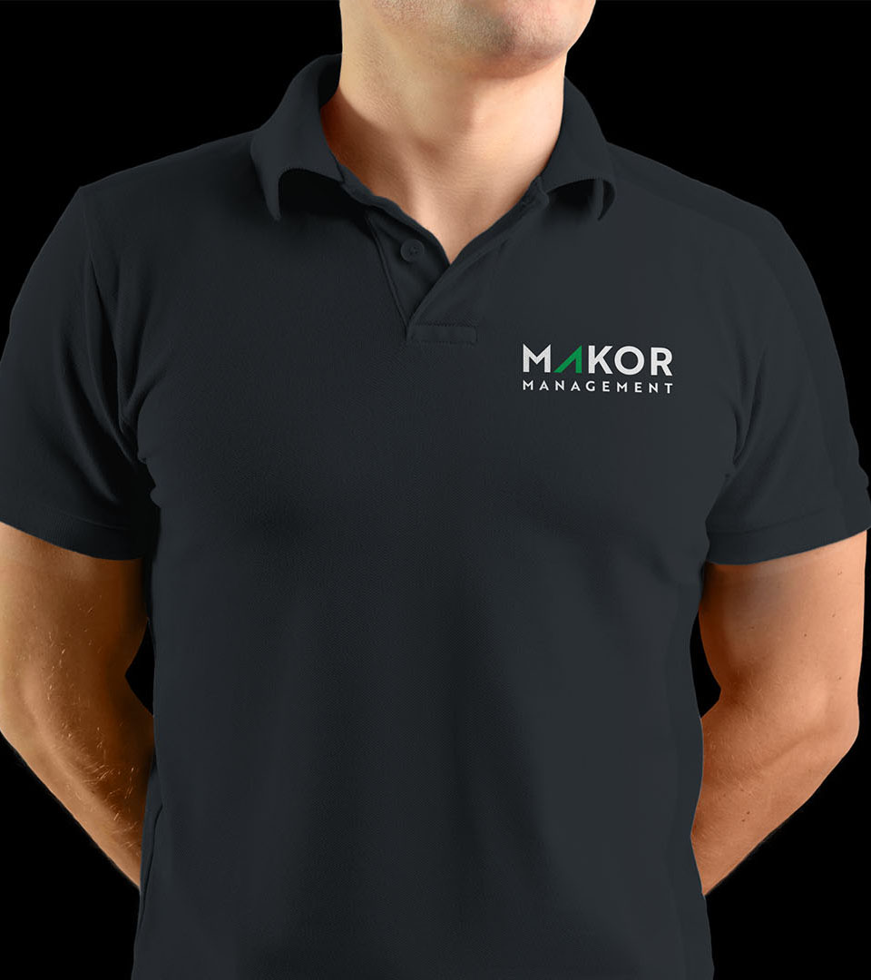 makor green logo on black shirt vertical