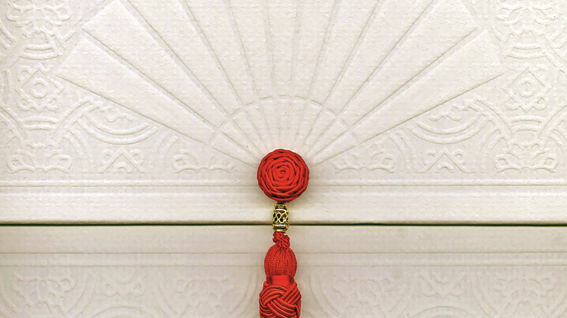 mandarin oriental box close up with red tassle cream color