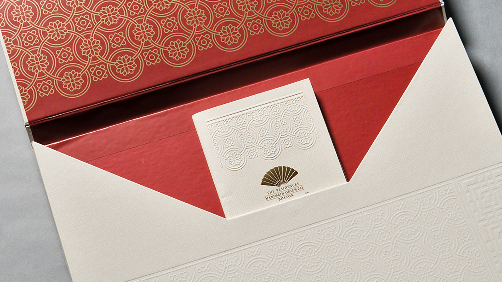 mandarin oriental box open with red interior and brochure