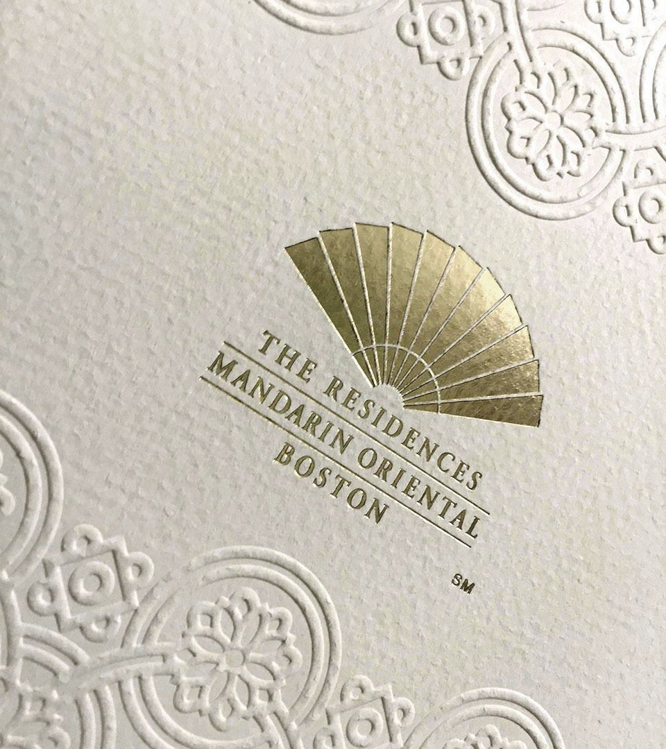 mandarin oriental brochure embossing with gold mandari hotel logo lighter