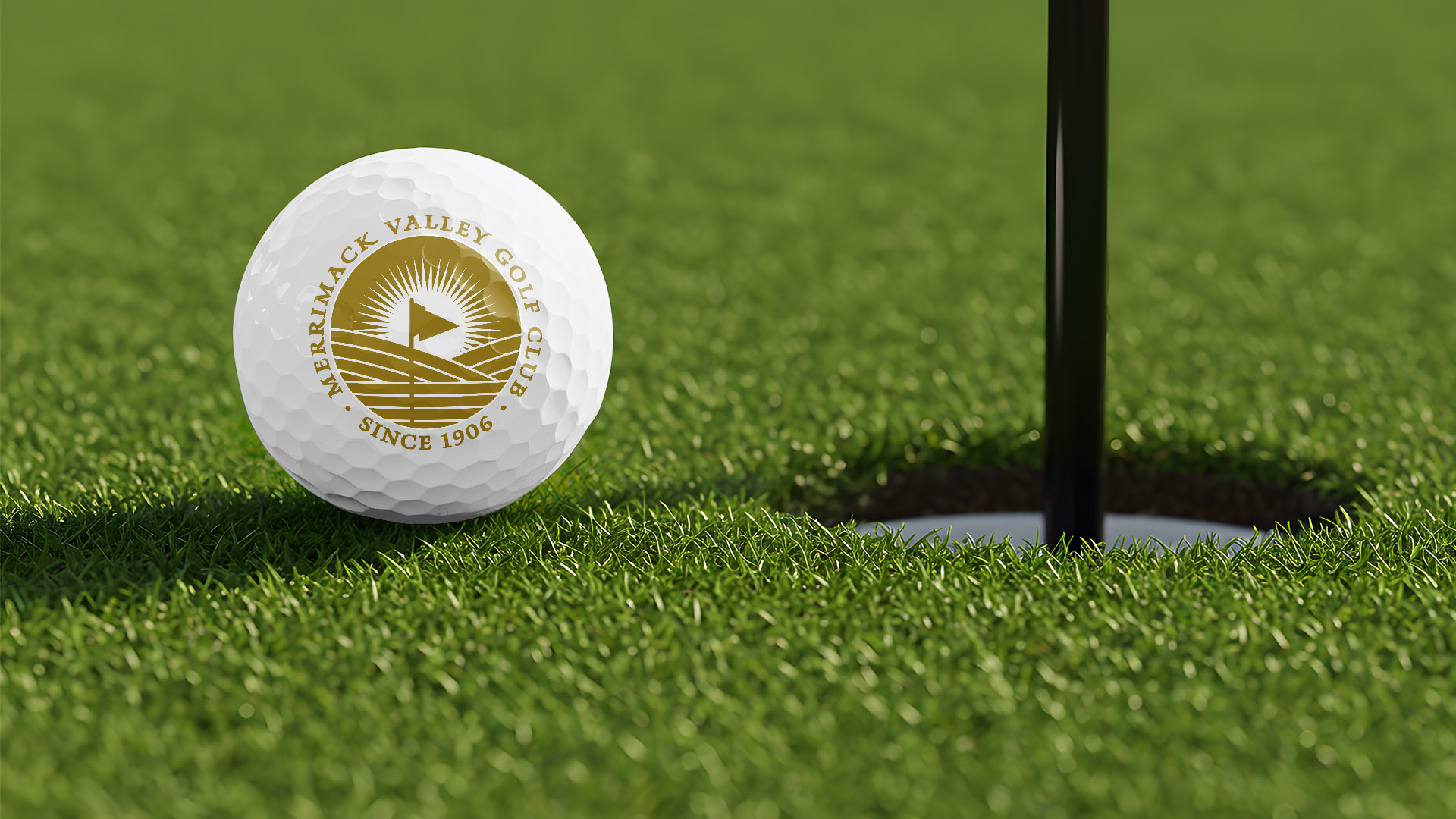 merrimack valley golf ball with gold logo