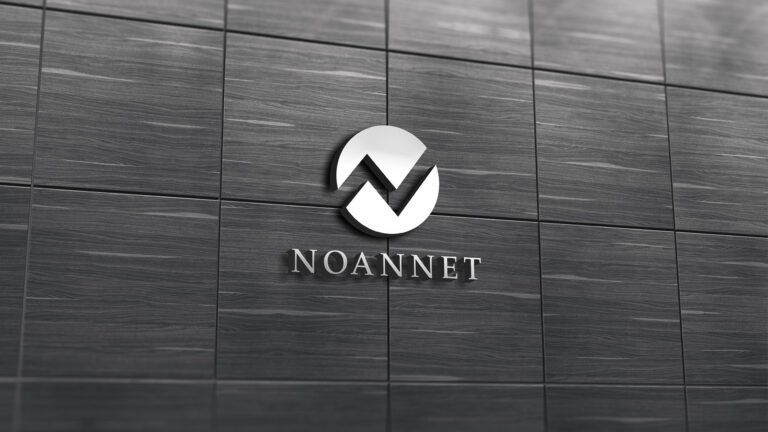 noannet silver logo on gray wall