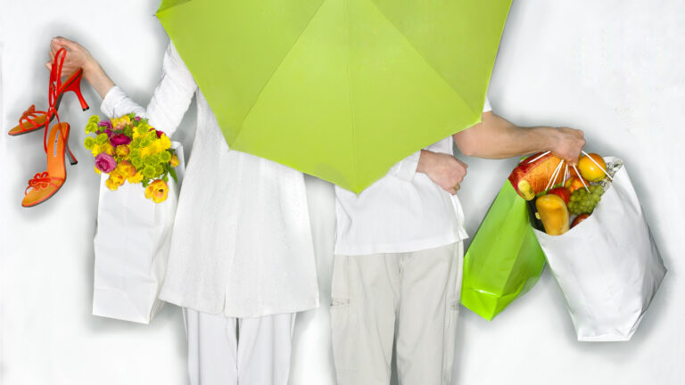 northpoint tango apartments couple in white with green umbrella.jpg