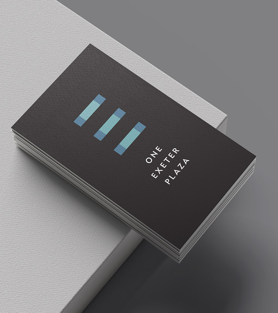 Branded stationery for One Exeter Plaza showing the geometric logo and modern visual system for a Boston office tower.