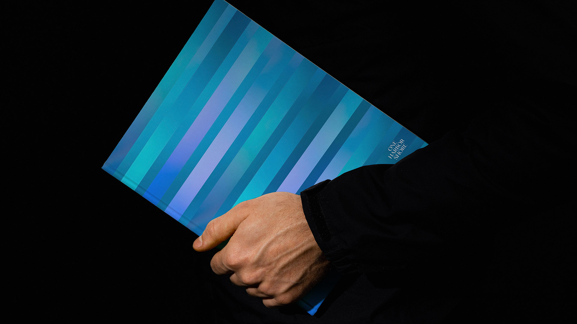 one harbor shore brochure cover with stripes and small logo