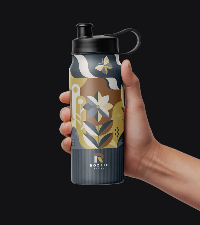 Tote bag with Rozzie Boston apartment branding and geometric pattern.