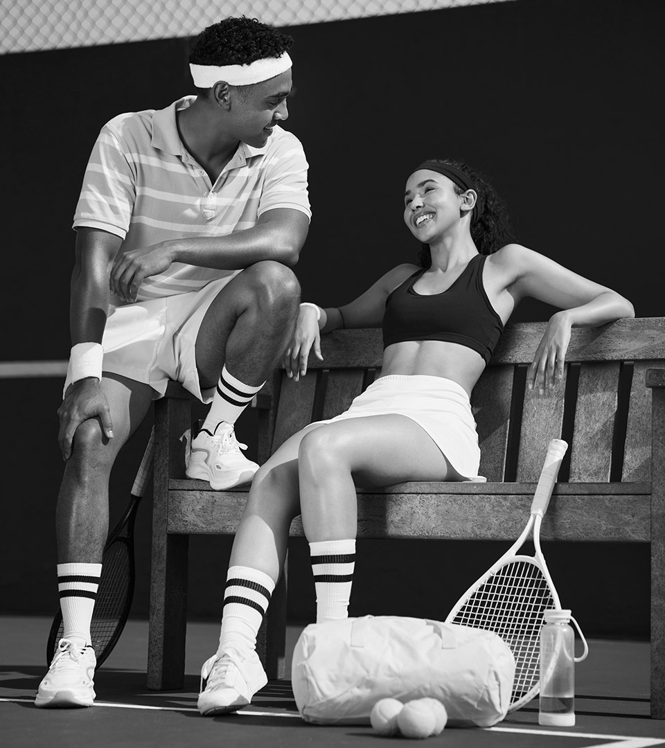 sudbury apartments couple sitting on bench after playing tennis
