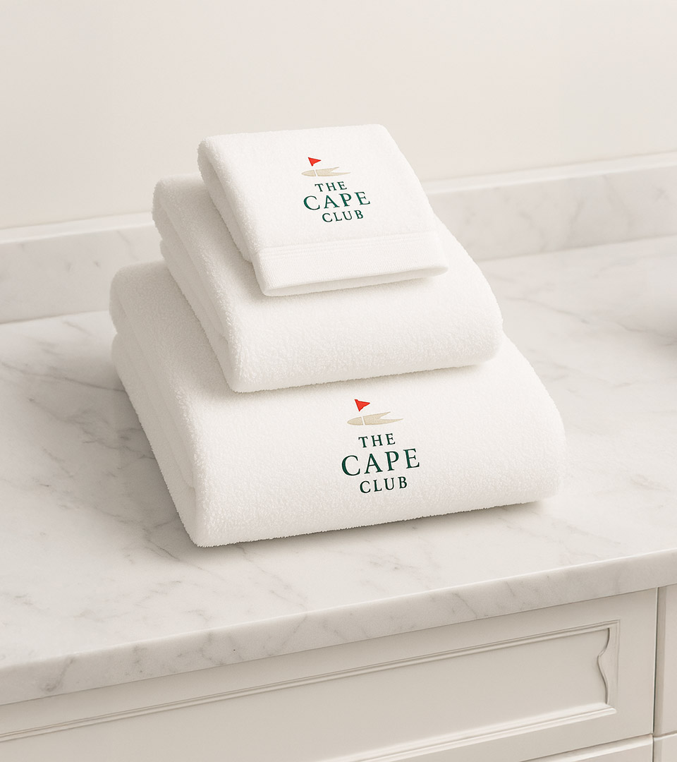the cape club white towels on vanity