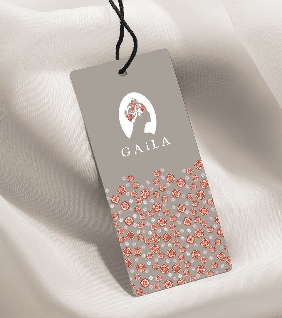 Adams Design, a boston graphic design firm, crafted the brand identity for Gaila, a non-profit who makes head wraps for patients with cancer and created the gaila hang tag on white silk vertical
