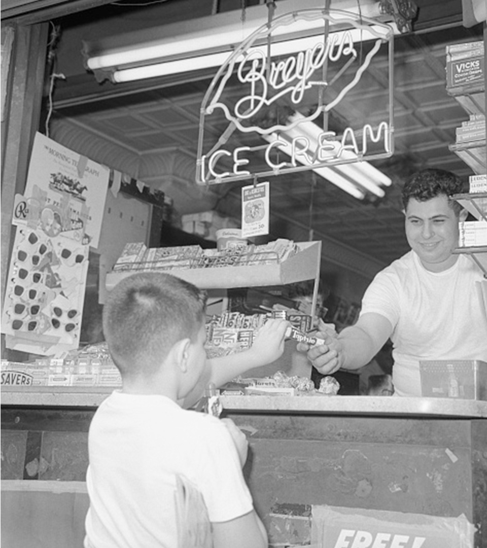 tootsie roll industries black and white photo of little boy being handed a tootsie roll