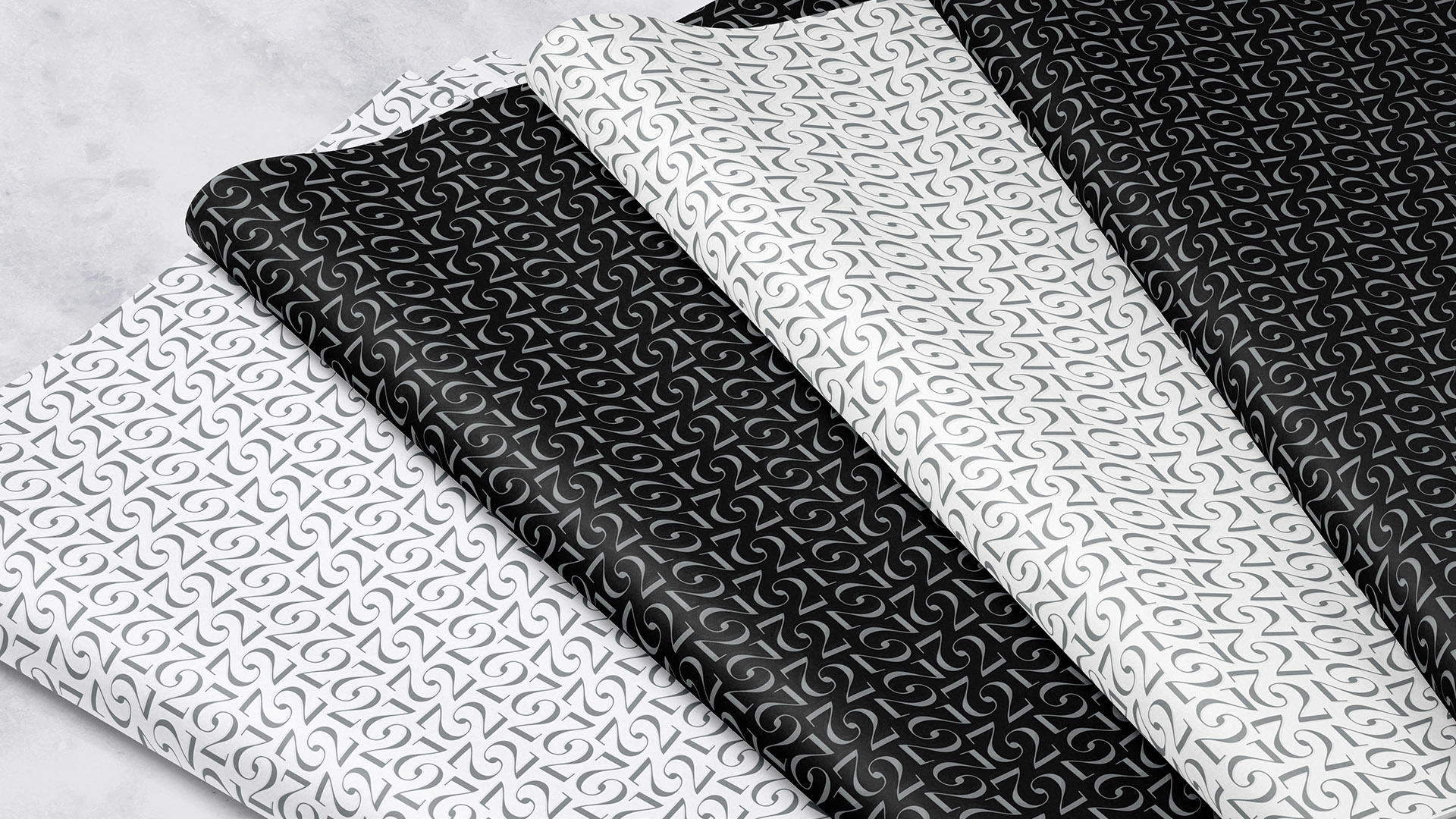 twenty two liberty black and white tissue paper alternating colors on marble counter