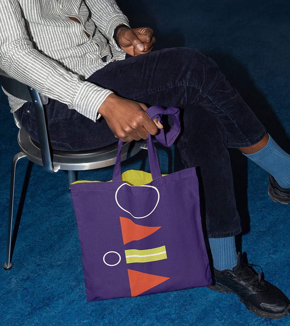 vivo apartments man sitting down with bag