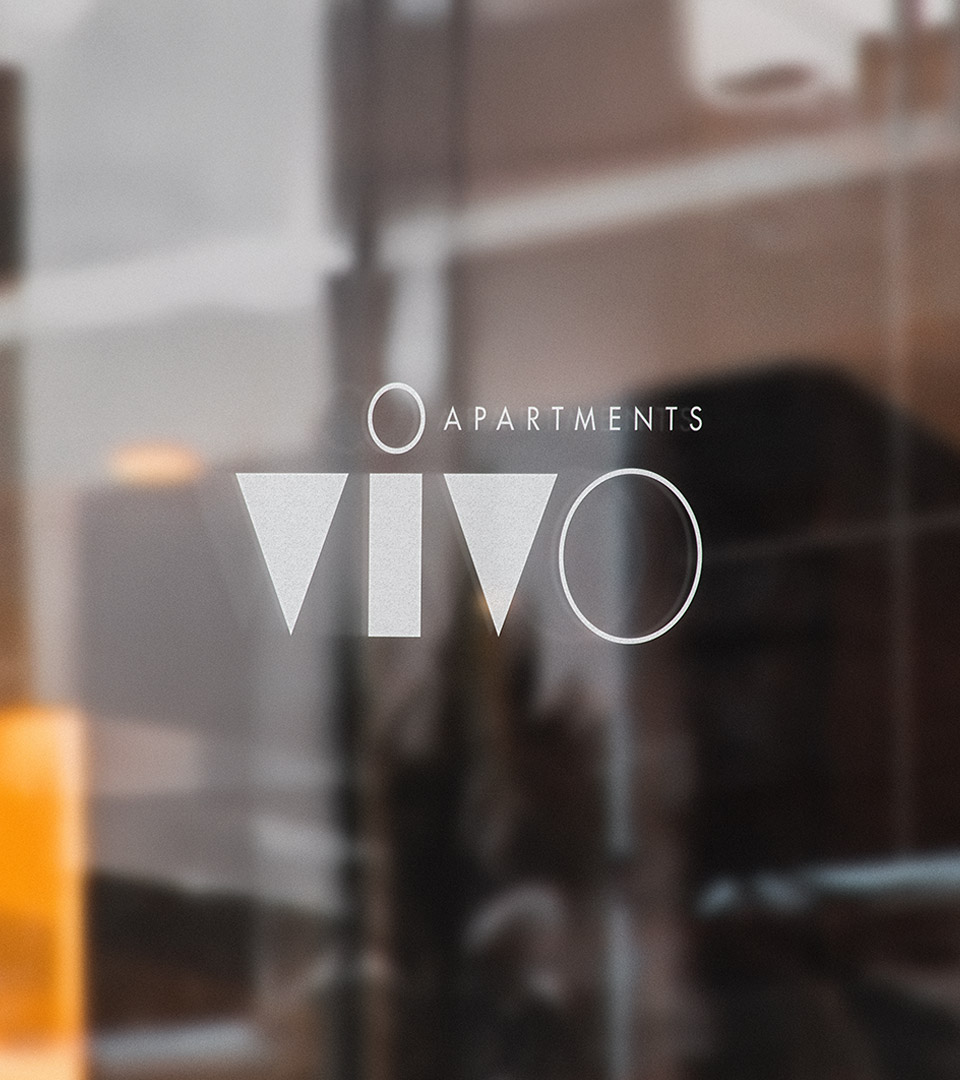 vivo apartments logo on glass window
